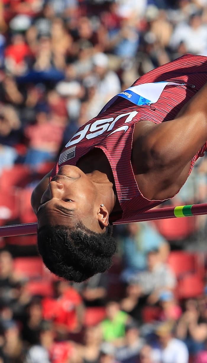 Coach Dontavious Hill clearing the bar — 5x NCAA All-American, 3x Team USA high jumper